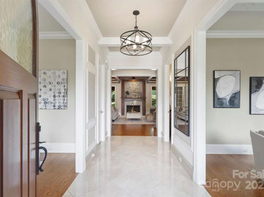 3032 Kings Manor Drive, Matthews, NC 28104.  MLS# CAR4265351, YatesRealty ID 19894. This beautiful entrance showcases the polished porcelain tile in the foyer.