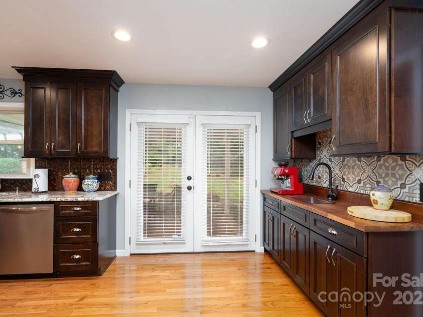 4145 Wrangler Drive, Concord, NC 28027.  MLS# CAR4249196, YatesRealty ID 19906. Doorway leads to the covered patio area