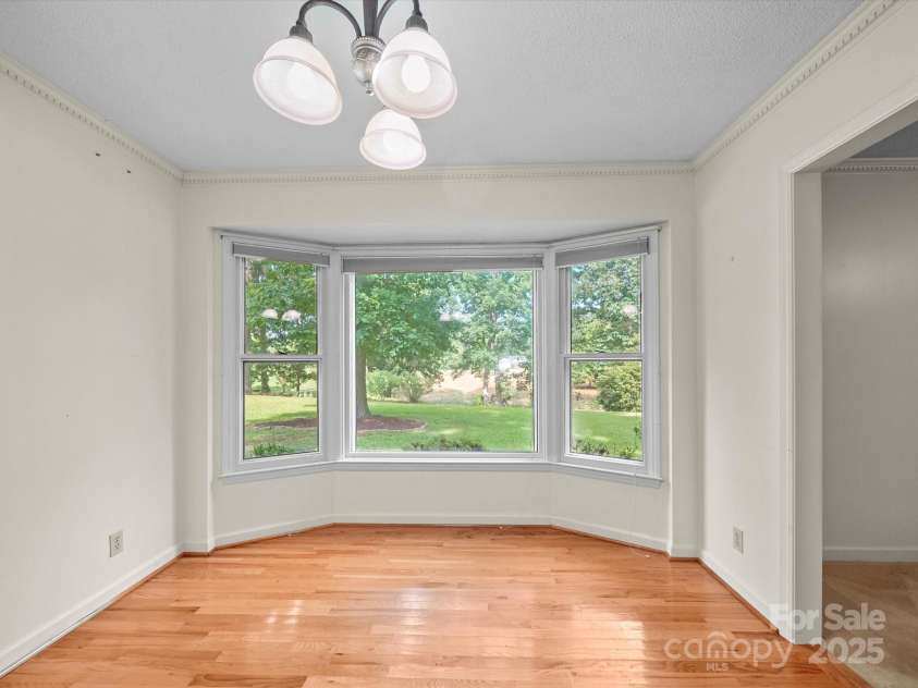 2831 Puetts Chapel Road, Bessemer City, NC 28016.  MLS# CAR4268907, YatesRealty ID 19907. Dining room with a bay window.
