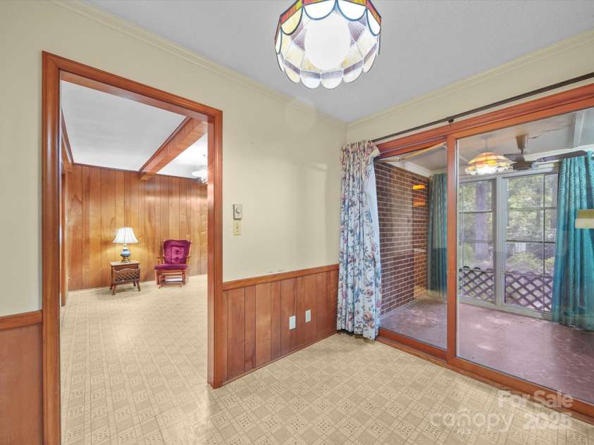 2831 Puetts Chapel Road, Bessemer City, NC 28016.  MLS# CAR4268907, YatesRealty ID 19907. Informal dining area overlooking the back screened in porch.