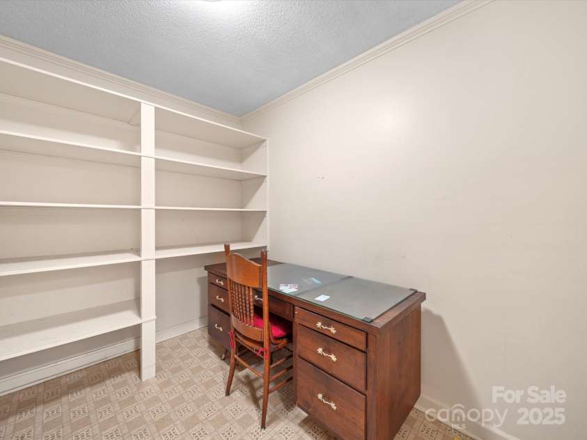 2831 Puetts Chapel Road, Bessemer City, NC 28016.  MLS# CAR4268907, YatesRealty ID 19907. Office with shelving