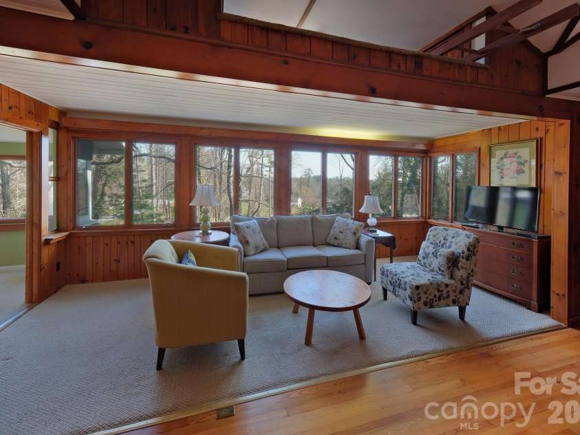 71 Norfolk Lane, Laurel Park, NC 28739.  MLS# CAR4345352, YatesRealty ID 19912. Living Room with panoramic windows -year-round mountain views