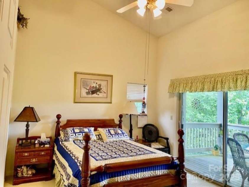 186 Stonecrest Court, Lake Lure, NC 28746.  MLS# CAR4270856, YatesRealty ID 19926. Primary bedroom with vaulted ceilings