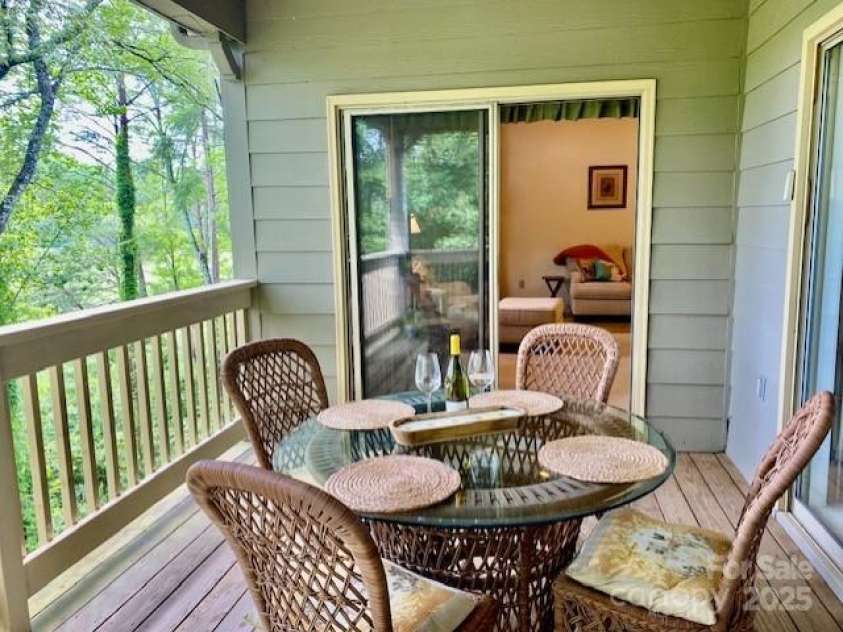 186 Stonecrest Court, Lake Lure, NC 28746.  MLS# CAR4270856, YatesRealty ID 19926. Sliding glass doors to porch from living room and master bedroom