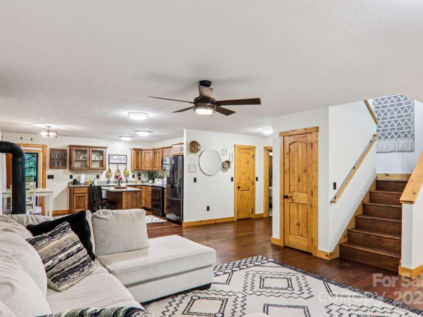2171 Black Rock Road, Cherokee, NC 28719.  MLS# CAR4270256, YatesRealty ID 19928. Living room showing stairs to 2nd floor