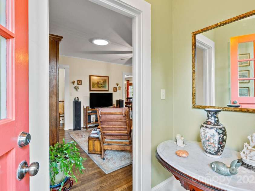 160 Hidden Hill Road, Tryon, NC 28782.  MLS# CAR4259798, YatesRealty ID 19956. Front entryway into the living room.