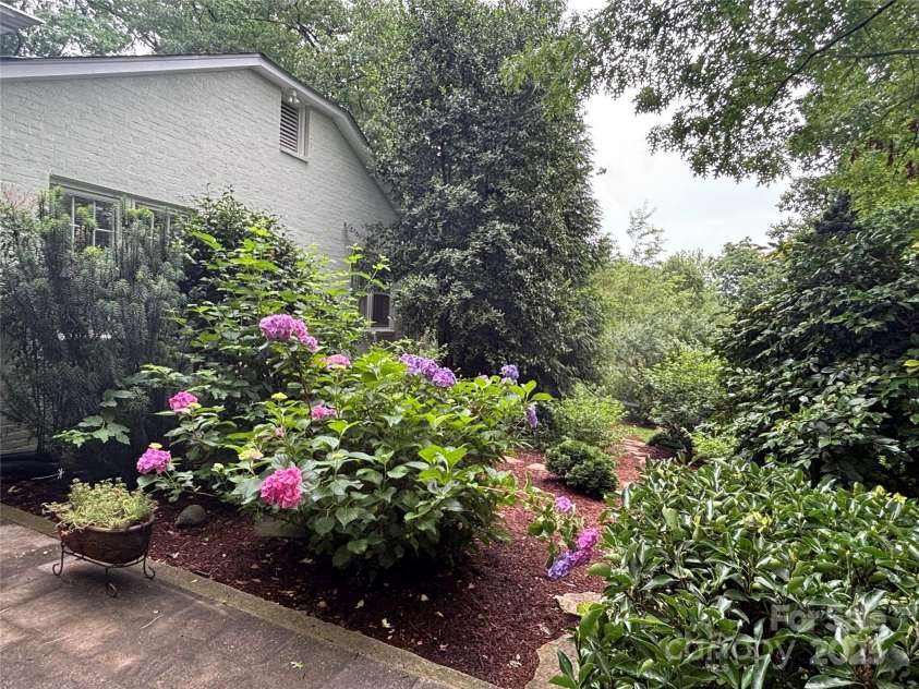 160 Hidden Hill Road, Tryon, NC 28782.  MLS# CAR4259798, YatesRealty ID 19956. Gorgeous gardens and landscape features.