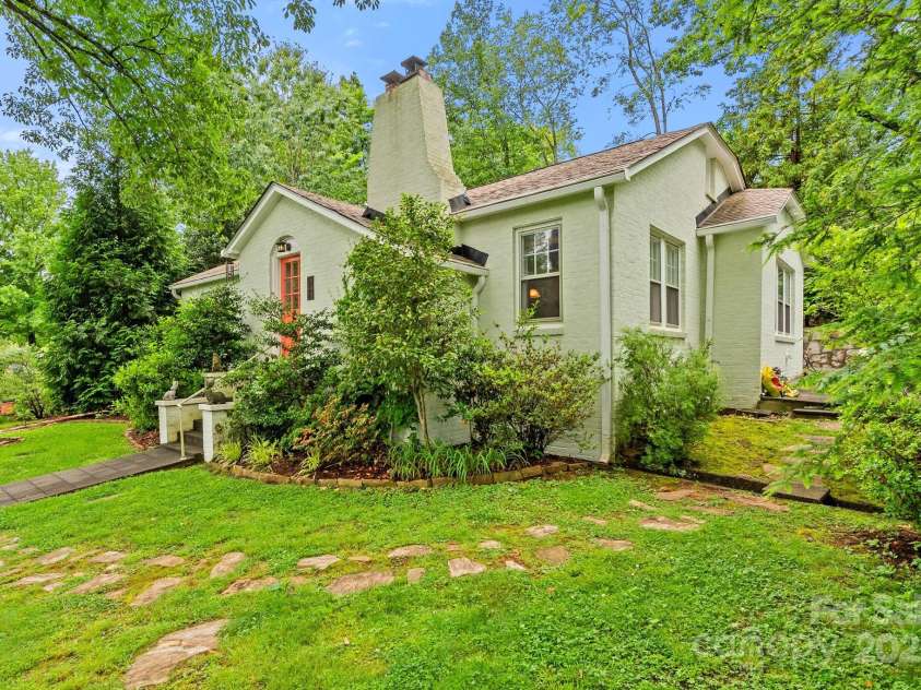 160 Hidden Hill Road, Tryon, NC 28782.  MLS# CAR4259798, YatesRealty ID 19956. Storybook cottage in downtown Tryon.