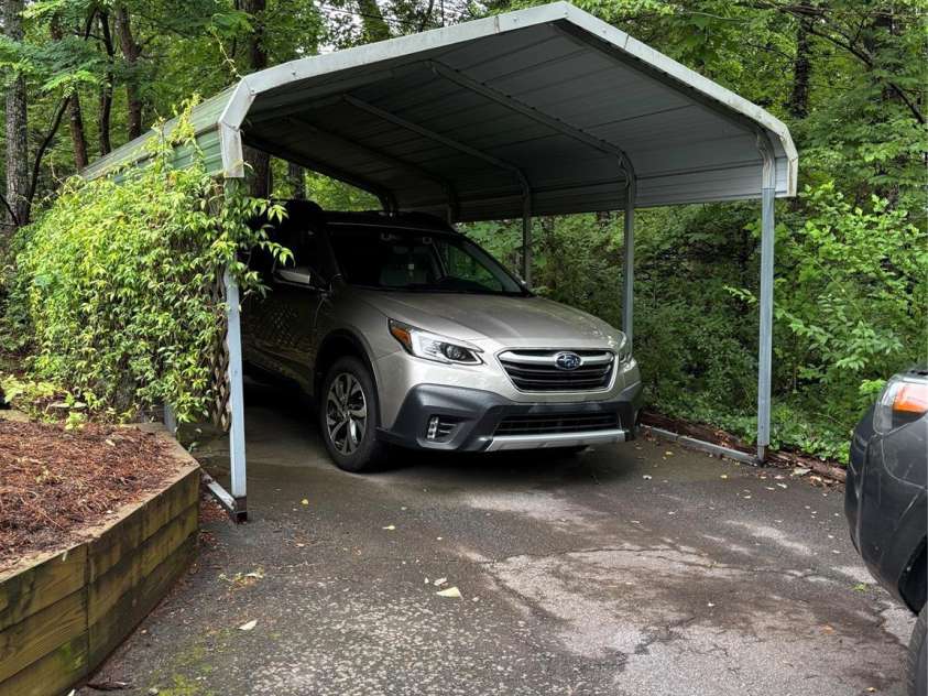 160 Hidden Hill Road, Tryon, NC 28782.  MLS# CAR4259798, YatesRealty ID 19956. There is a carport and a separate one car brick garage