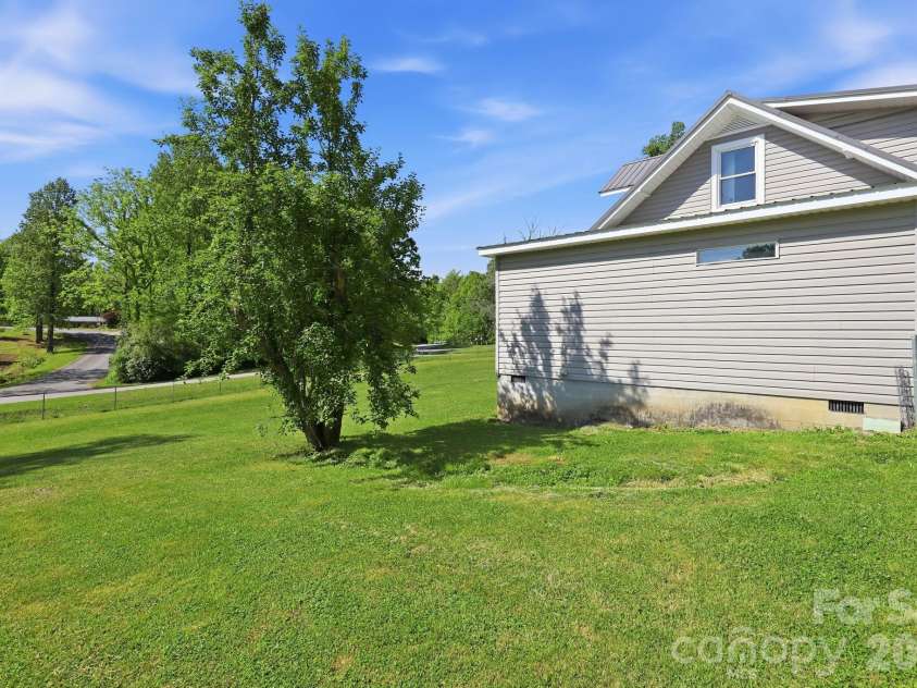 5054 Sugar Hill Road, Marion, NC 28752.  MLS# CAR4359799, YatesRealty ID 19956. Side Yard