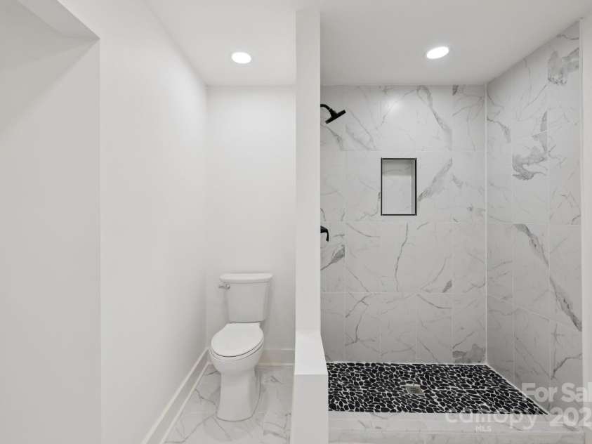 431 Pole Miller Extension, Brevard, NC 28712.  MLS# CAR4269813, YatesRealty ID 19961. Tile showers and custom cabinets in main bath.