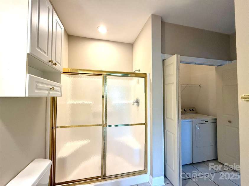 8668 Coralbell Lane, Charlotte, NC 28213.  MLS# CAR4225758, YatesRealty ID 19966. First primary bathroom, includes closet for washer/dryer which remain with the unit.