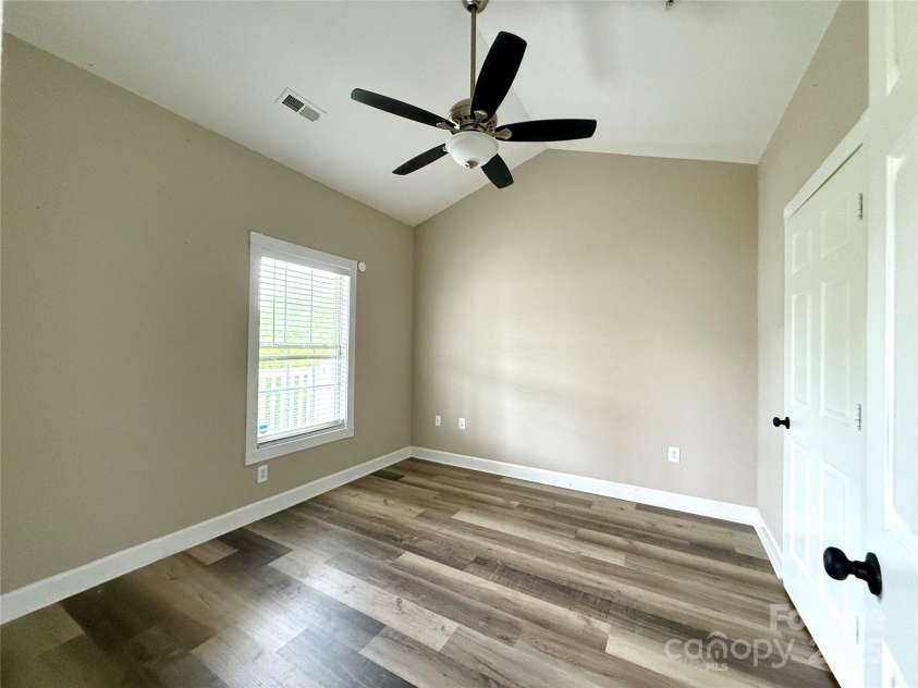 8668 Coralbell Lane, Charlotte, NC 28213.  MLS# CAR4225758, YatesRealty ID 19966. First primary bedroom with large closet, and access to full bath.