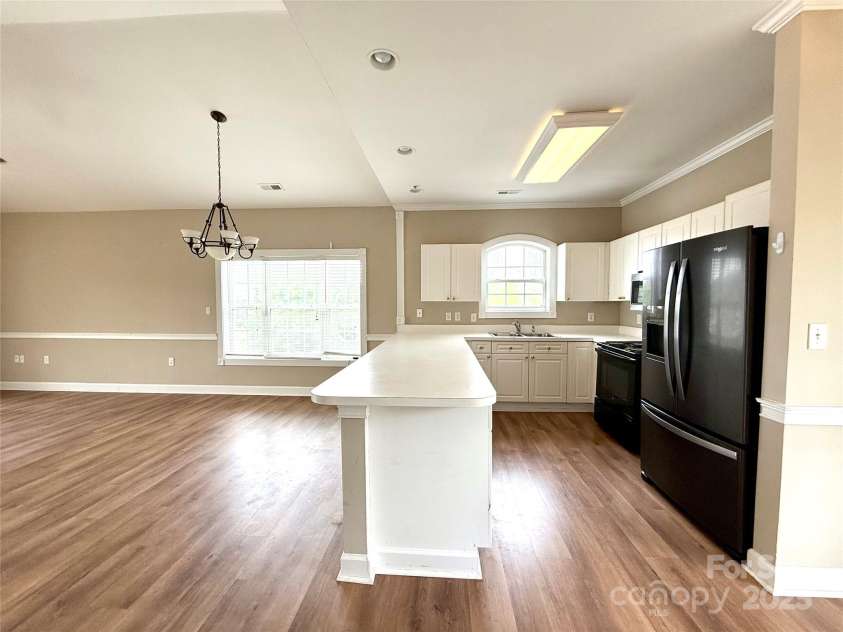 8668 Coralbell Lane, Charlotte, NC 28213.  MLS# CAR4225758, YatesRealty ID 19966. Large open kitchen with plenty of storage.