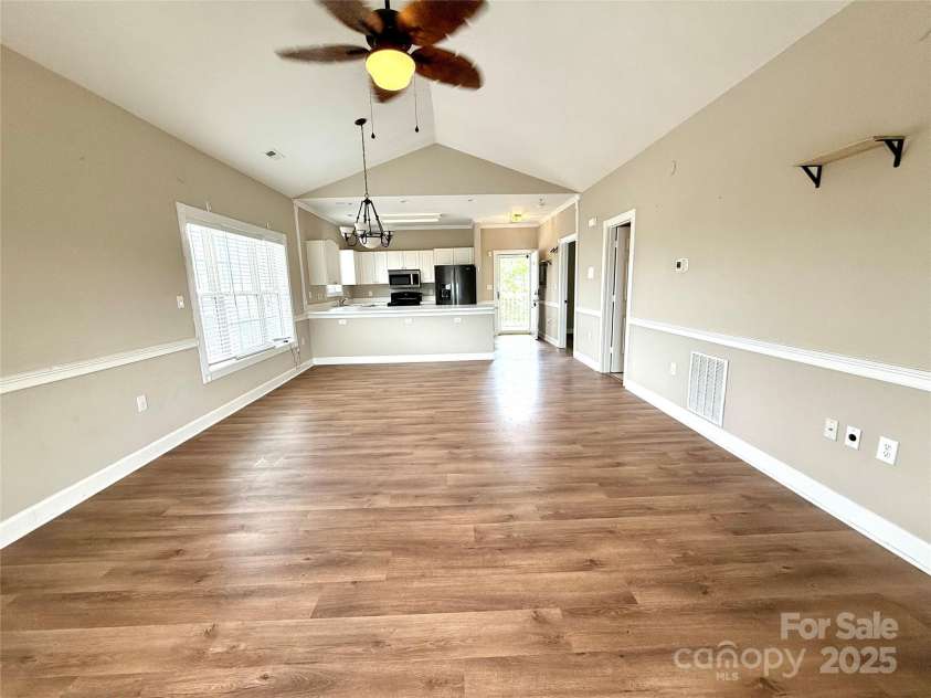 8668 Coralbell Lane, Charlotte, NC 28213.  MLS# CAR4225758, YatesRealty ID 19966. Living room. . . Open floor plan.