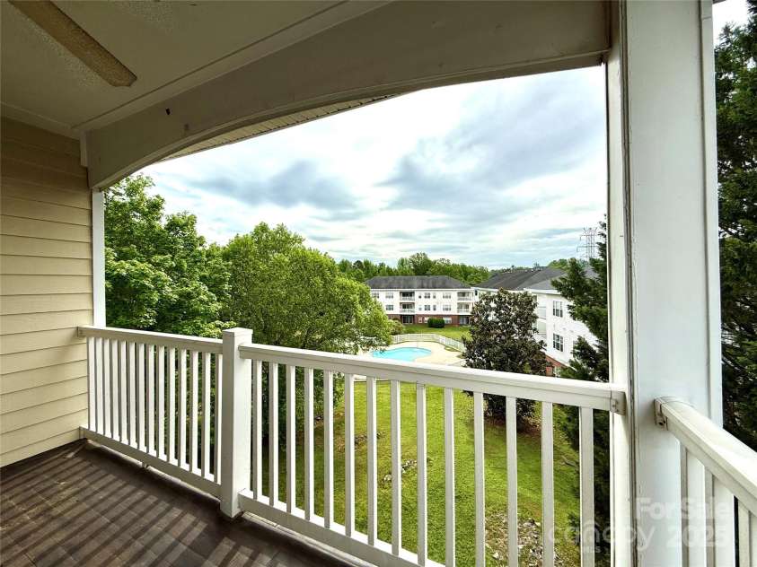 8668 Coralbell Lane, Charlotte, NC 28213.  MLS# CAR4225758, YatesRealty ID 19966. Lovely covered porch for quiet summer evenings.