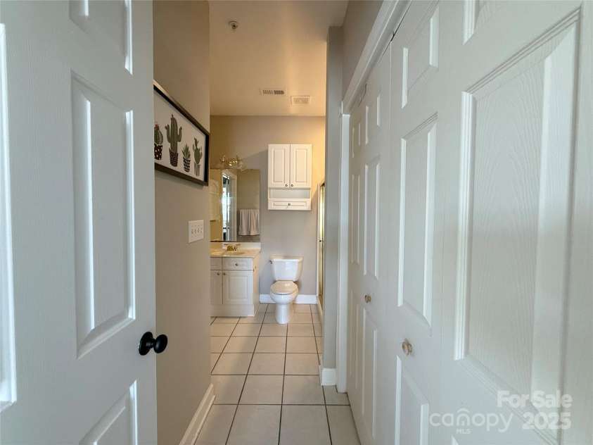 8668 Coralbell Lane, Charlotte, NC 28213.  MLS# CAR4225758, YatesRealty ID 19966. Washer/Dryer located in bathroom