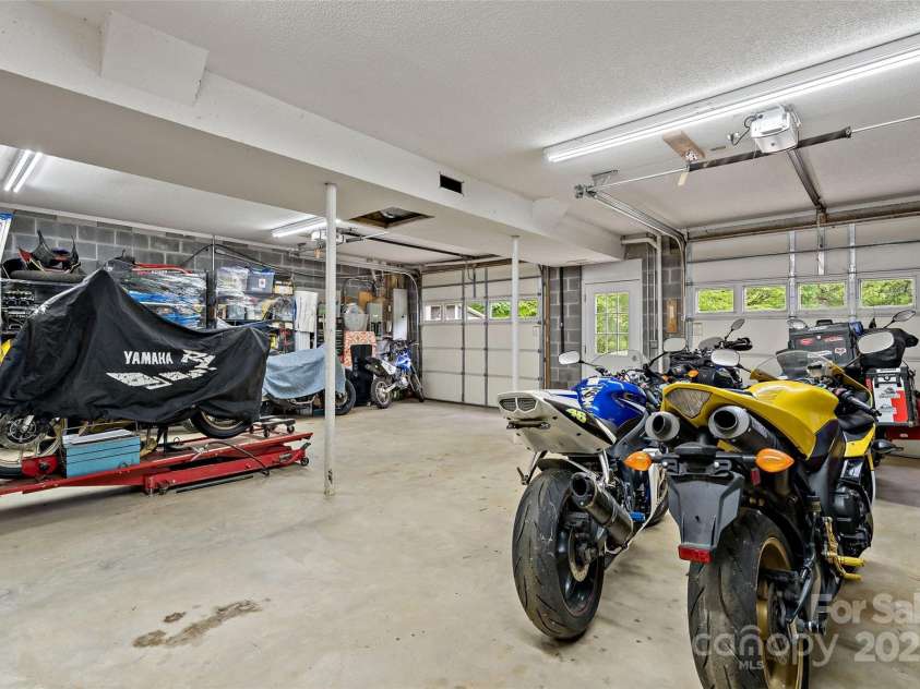 423 Cad Campbell Road, Bakersville, NC 28705.  MLS# CAR4256266, YatesRealty ID 19968. Huge garage with oversized doors