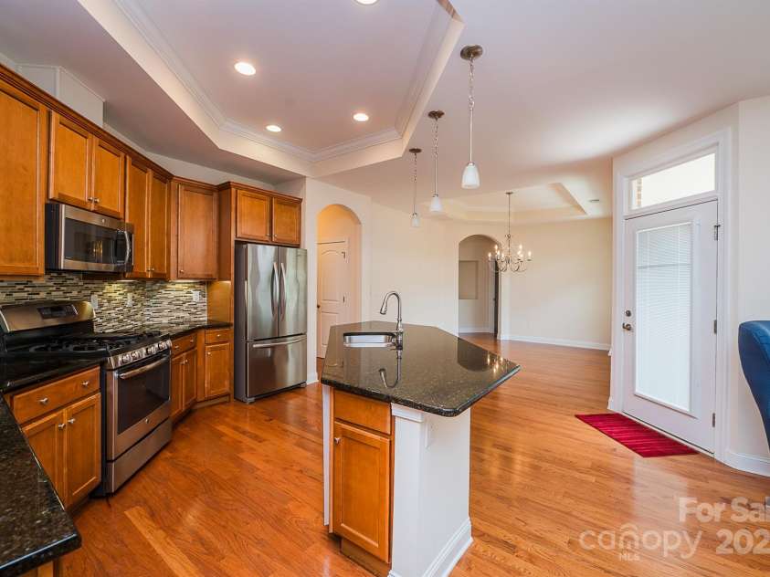 4518 COURTYARD Boulevard, Harrisburg, NC 28075.  MLS# CAR4267459, YatesRealty ID 19971. Kitchen and Island