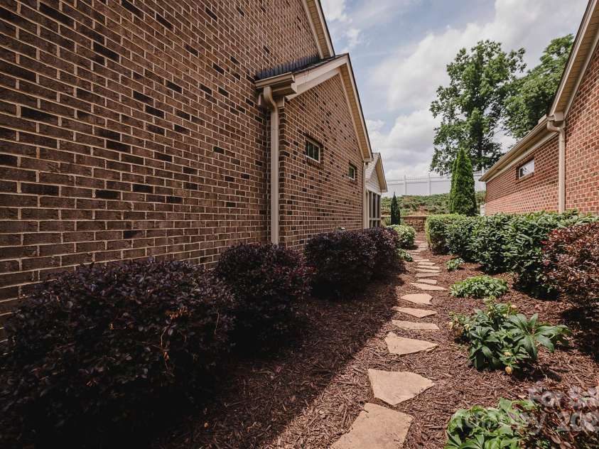 4518 COURTYARD Boulevard, Harrisburg, NC 28075.  MLS# CAR4267459, YatesRealty ID 19971. Side Garden Path