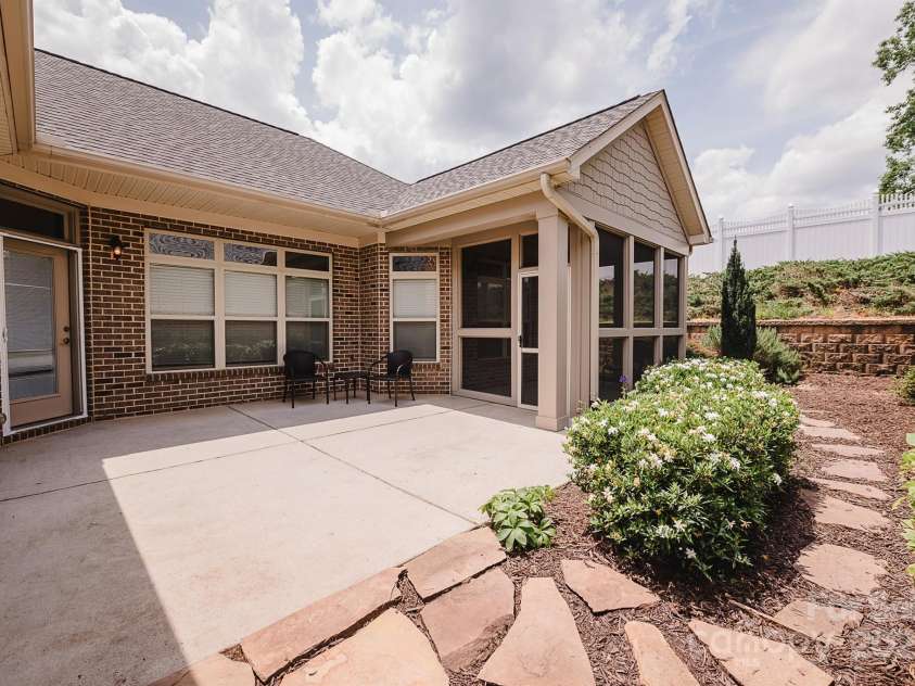 4518 COURTYARD Boulevard, Harrisburg, NC 28075.  MLS# CAR4267459, YatesRealty ID 19971. Side Porch and the Garden Path