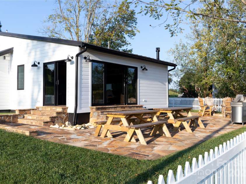 668 Old Hendersonville Highway, Brevard, NC 28712.  MLS# CAR4264741, YatesRealty ID 19974. Large Rock Patio for Entertaining