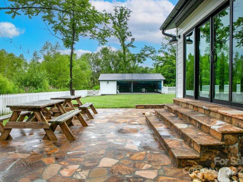 668 Old Hendersonville Highway, Brevard, NC 28712.  MLS# CAR4264741, YatesRealty ID 19974. Patio to Workshop