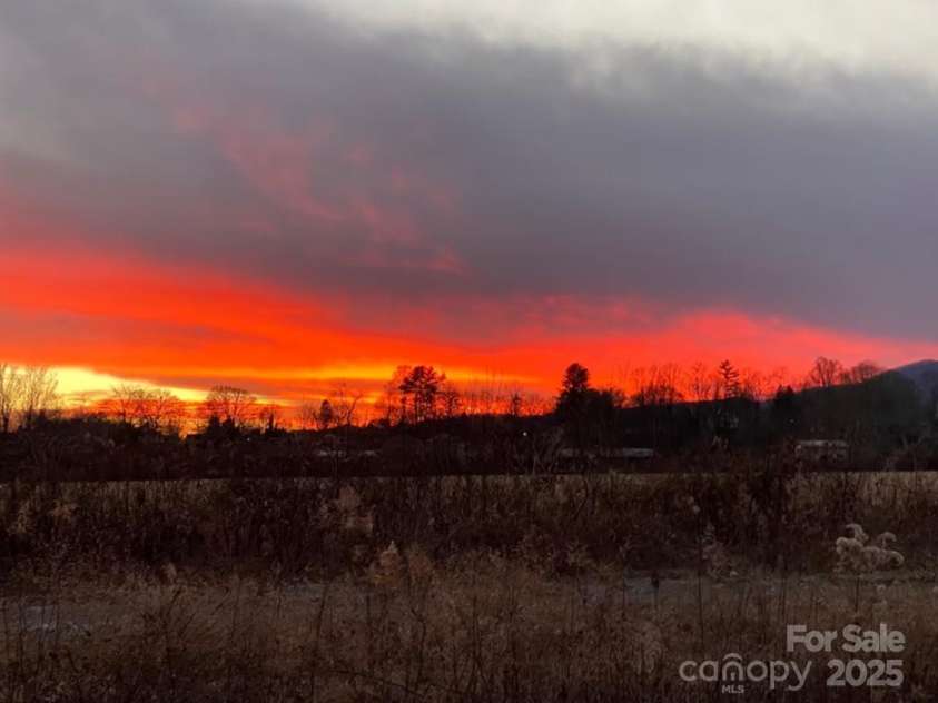 668 Old Hendersonville Highway, Brevard, NC 28712.  MLS# CAR4264741, YatesRealty ID 19974. Sunset from Yard