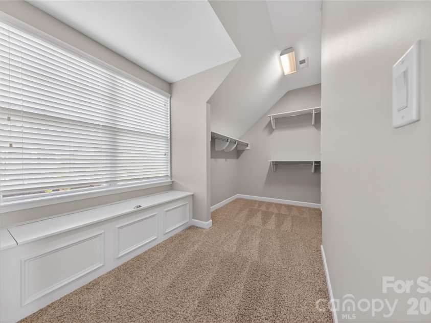 5220 Meadowcroft Way, Fort Mill, SC 29708.  MLS# CAR4370606, YatesRealty ID 19978. Primary Closet with Storage Bench