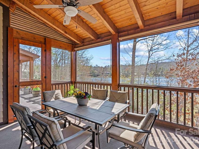 4948 Connestee Trail, Brevard, NC 28712.  MLS# CAR4231748, YatesRealty ID 1998. Dine al fresco on the  screened porch...