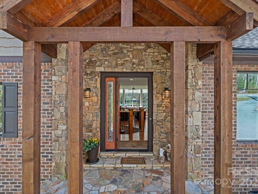 4948 Connestee Trail, Brevard, NC 28712.  MLS# CAR4231748, YatesRealty ID 1998. Gorgeous home on a stunning 1+ acre lot...