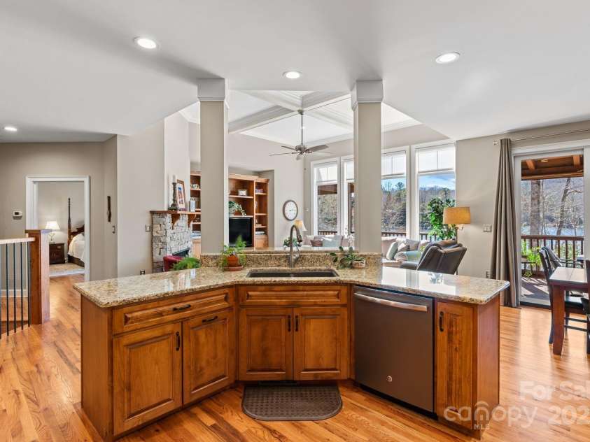 4948 Connestee Trail, Brevard, NC 28712.  MLS# CAR4231748, YatesRealty ID 1998. Large prep island connects the kitchen to the living / dining areas