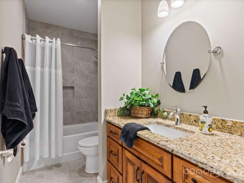4948 Connestee Trail, Brevard, NC 28712.  MLS# CAR4231748, YatesRealty ID 1998. Private guest bath with tub-shower combo