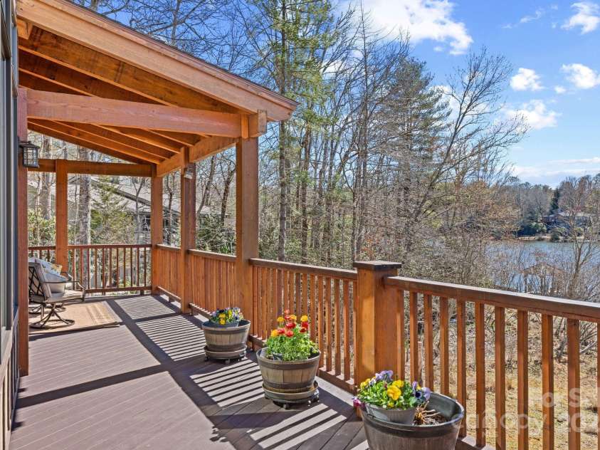 4948 Connestee Trail, Brevard, NC 28712.  MLS# CAR4231748, YatesRealty ID 1998. Relax by the water on the open or covered decks...