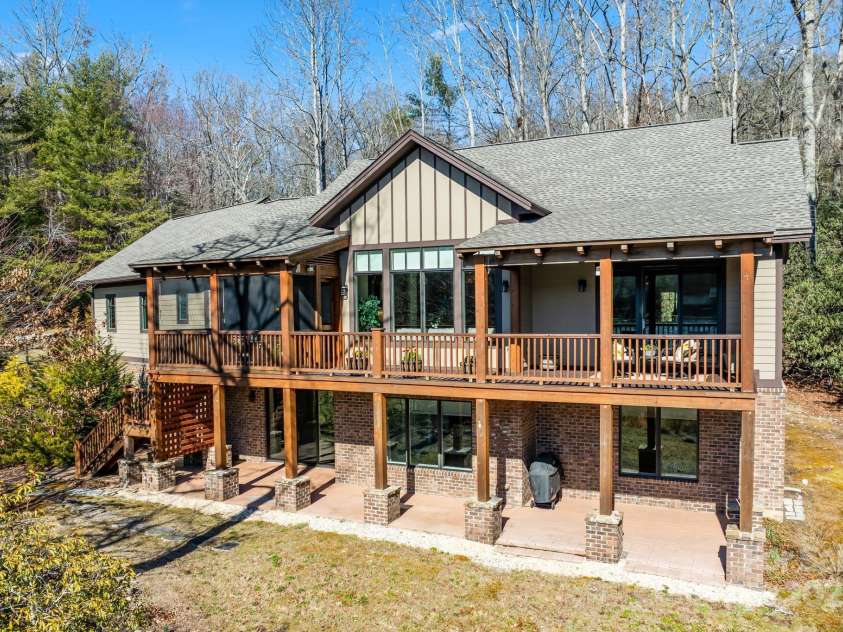 4948 Connestee Trail, Brevard, NC 28712.  MLS# CAR4231748, YatesRealty ID 1998. Stunning lake views from the upper & lower levels.