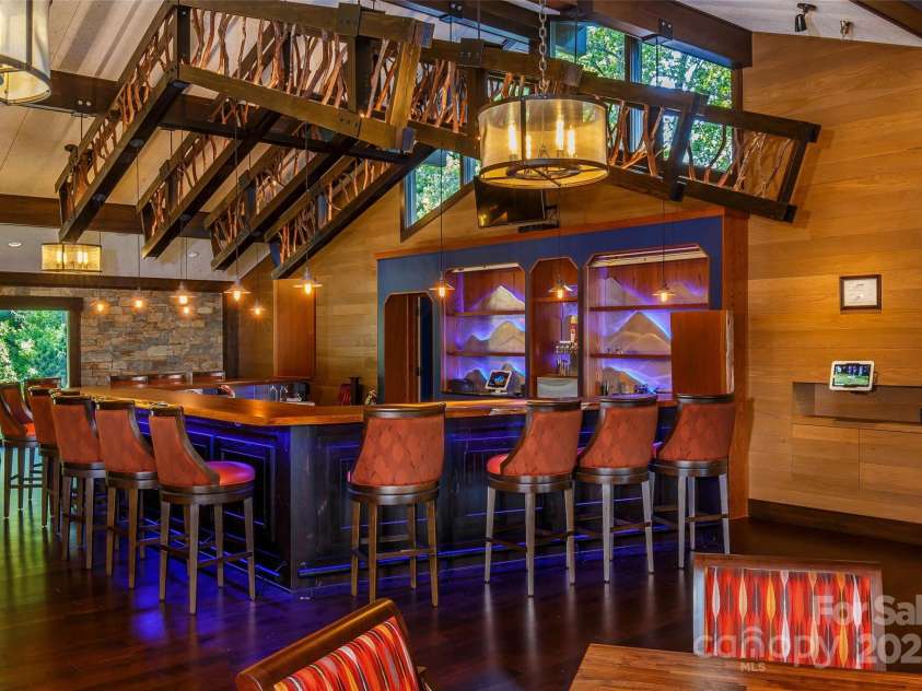 4948 Connestee Trail, Brevard, NC 28712.  MLS# CAR4231748, YatesRealty ID 1998. The lounge hosts live music, parties & special events