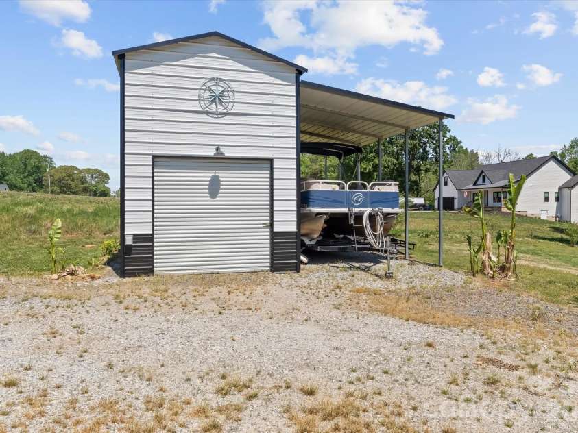 355 Cal Kennedy Road, Cleveland, NC 27013.  MLS# CAR4371840, YatesRealty ID 19980. 12'x25' enclosed (with loft) outbuilding wired with 220 volt electrical service would make a great shop or just a convenient hookup location for your RV