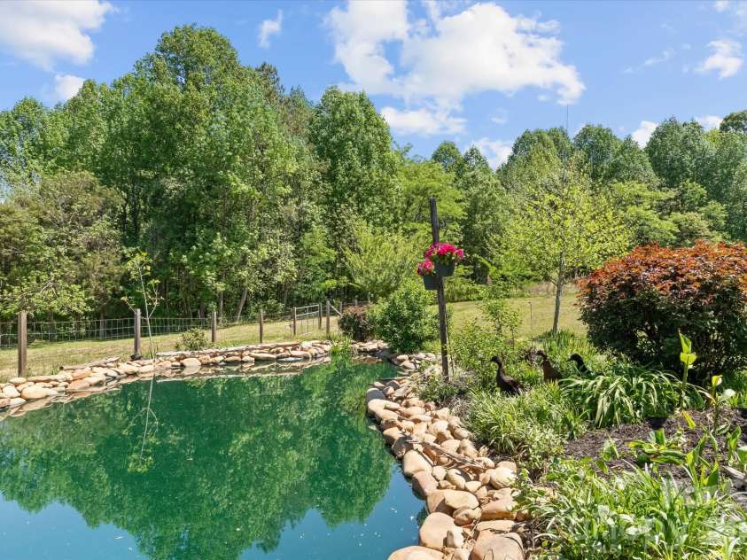 355 Cal Kennedy Road, Cleveland, NC 27013.  MLS# CAR4371840, YatesRealty ID 19980. A beautifully constructed pond water feature with recirculating pump is a perfect place for ducks to take a dip.  Pond is nearly 6' deep!