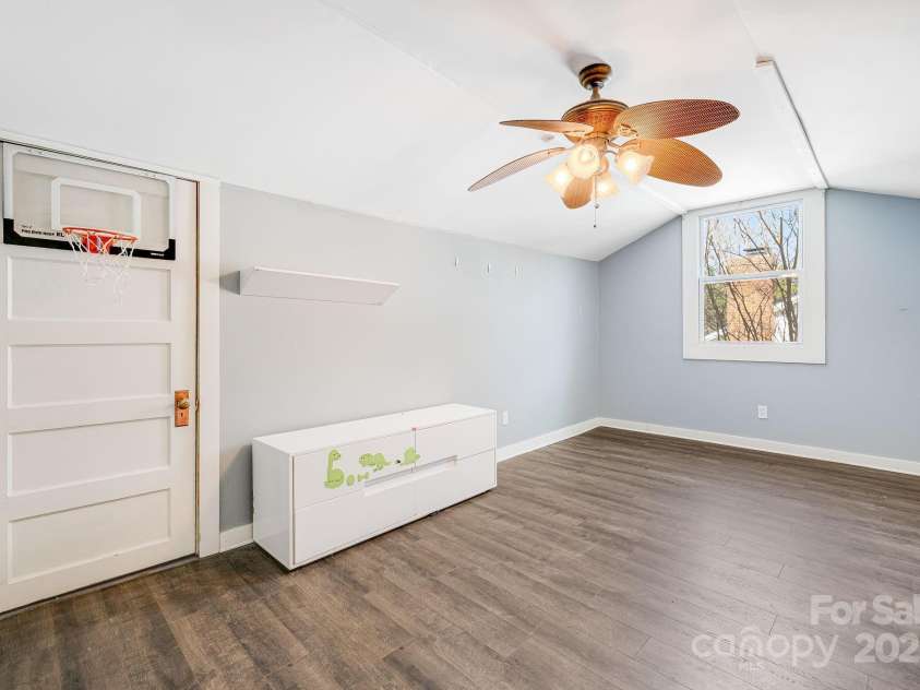 74 Beverly Road, Asheville, NC 28805.  MLS# CAR4239115, YatesRealty ID 19986. Upper level, bedroom 2 with attice storage