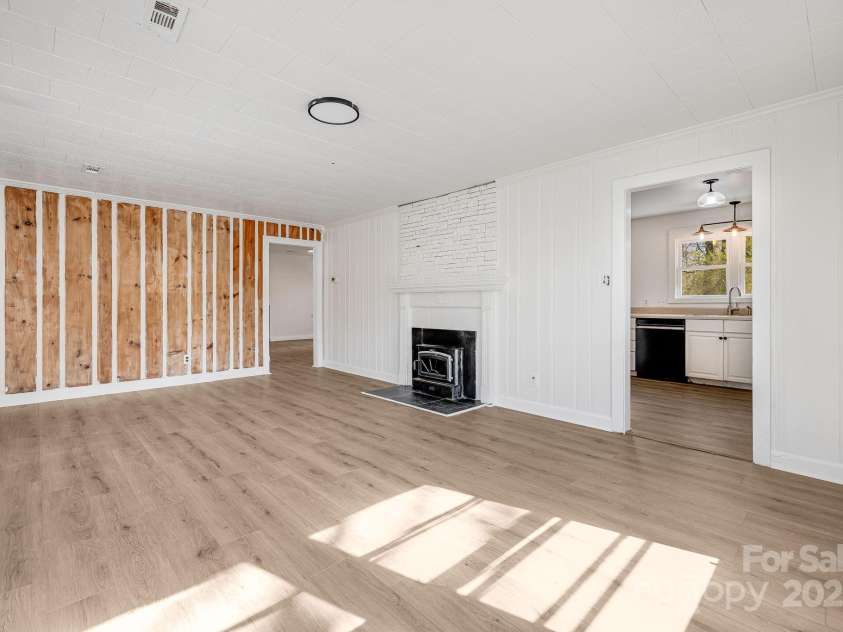 74 Beverly Road, Asheville, NC 28805.  MLS# CAR4239115, YatesRealty ID 19986. Wood burning stove!