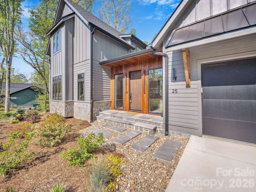 25 Ted Linn Drive, Fairview, NC 28730.  MLS# CAR4374836, YatesRealty ID 19987. Beautiful Landscaping/Hardscaped Entry