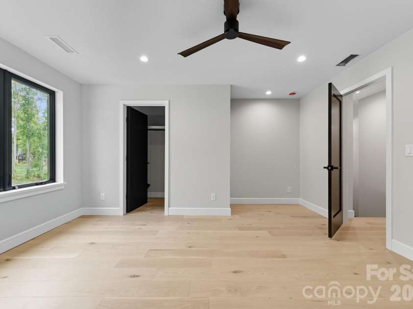 25 Ted Linn Drive, Fairview, NC 28730.  MLS# CAR4374836, YatesRealty ID 19987. Bedroom Three Walk-in Closet and Desk Nook