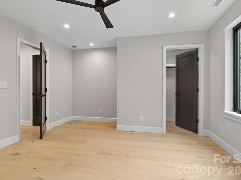 25 Ted Linn Drive, Fairview, NC 28730.  MLS# CAR4374836, YatesRealty ID 19987. Both Upper Level Bedrooms Feature Walk-in Closets and Desk Nooks