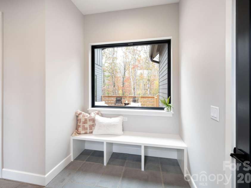 25 Ted Linn Drive, Fairview, NC 28730.  MLS# CAR4374836, YatesRealty ID 19987. Mudroom Bench Area in Dogtrot