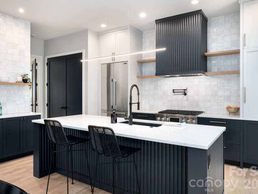 25 Ted Linn Drive, Fairview, NC 28730.  MLS# CAR4374836, YatesRealty ID 19987. Spectacular Chef's Kitchen with Oversized Island, Quartz Counters and Luxury Appliances