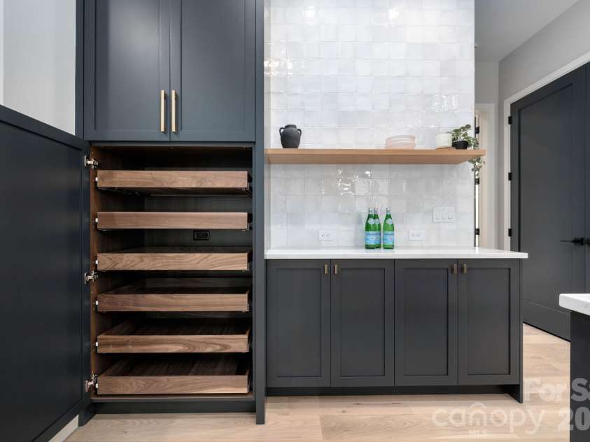 25 Ted Linn Drive, Fairview, NC 28730.  MLS# CAR4374836, YatesRealty ID 19987. Spectacular Custom Cabinetry Storage and Bar Space