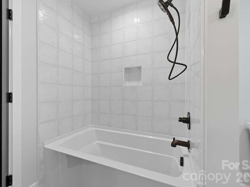 25 Ted Linn Drive, Fairview, NC 28730.  MLS# CAR4374836, YatesRealty ID 19987. Upper Level Soaking Tub and Shower Combo