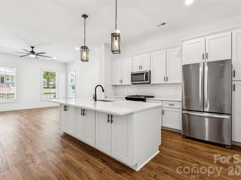 5850 Pittmon Lane, Kannapolis, NC 28081.  MLS# CAR4374429, YatesRealty ID 19990. Open concept, tall ceilings, tons of natural light, large kitchen with ample cabinets.. even on the other side of the island