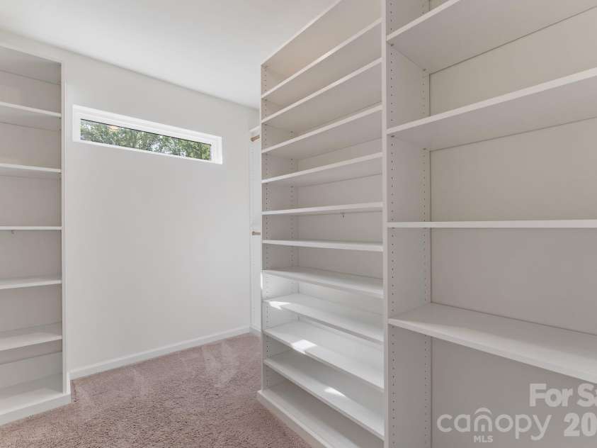 230 Quinn Road, Matthews, NC 28104.  MLS# CAR4378712, YatesRealty ID 19995. Fully customized closet in primary