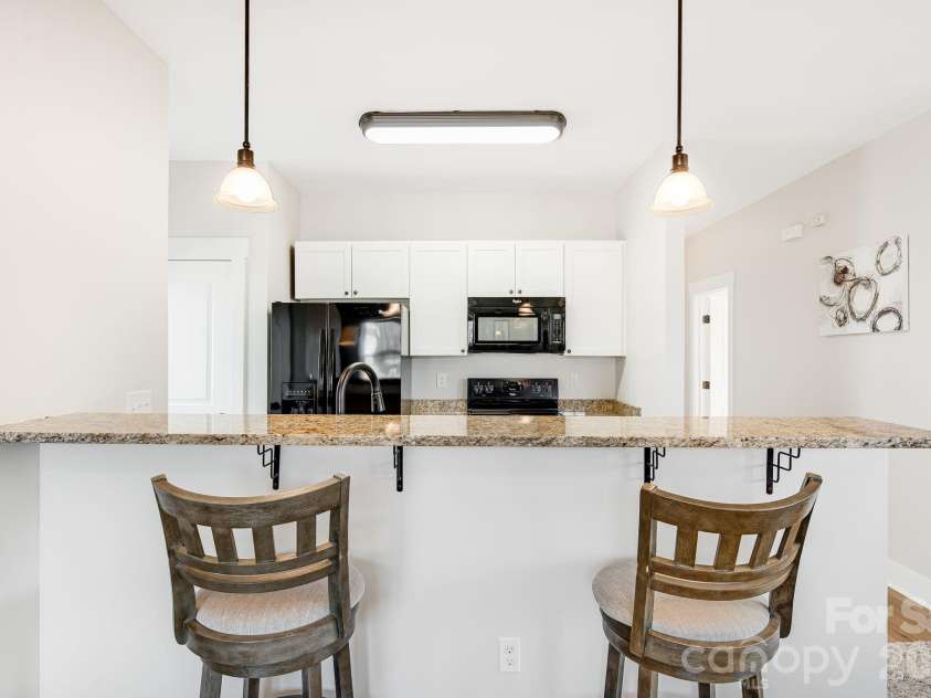 11 Byrdcliffe Lane, Asheville, NC 28805.  MLS# CAR4320731, YatesRealty ID 19996. Eat at Granite Kitchen Bar